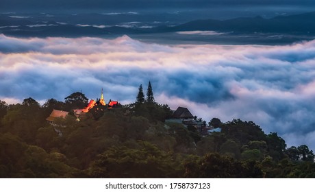 Wat Phra That Doi Suthep Temple with misty fog and sunlight morning on mountain important Landmark Travel Place of Chiang Mai, Thailand