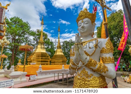 Wat Phra That Doi Tung is a beautiful golden temple in Chiang Rai province, Thailand.