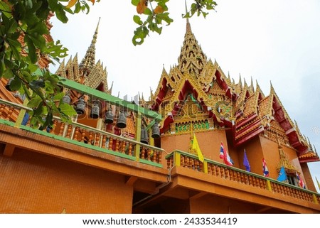 Wat tham suea or Tiger Cave Temple in Kanchanaburi, Thailand, cloudy sky with copy space for text