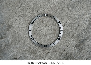 watch insert bezel ring on wooden background                                      