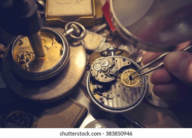 A watch maker repairing a vintage automatic watch.