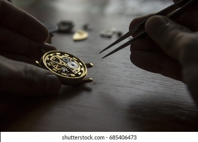 A Watch Maker Is Repairing A Vintage Automatic Watch.