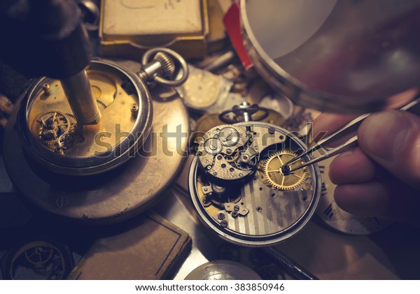 A watch
maker repairing a vintage automatic
watch.