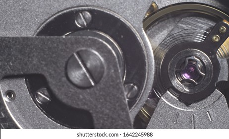 Watch mechanism macro loop. Old vintage clock mechanism working, closeup shot with soft focus. Close up of a internal clock mechanism. Watch gears movement macro. Time Keeping.