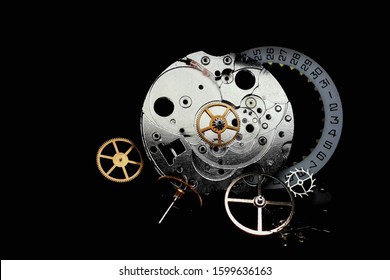 watch parts on a black background . small detail mechanical clock close-up. Time stopped