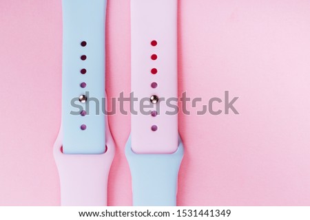 Watchband. Silicone strap for sports watches. Color bracelet for smart watches on pink background