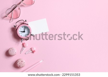 watches, glasses, hairpins, pen and macaroons in pink colors. copy space. items for women. frame, mockup copy space. party for girls. relax concept