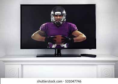 Watching American Football Game On Television At Home. Leisure And Entertainment Concept.