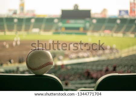 Watching baseball from stand