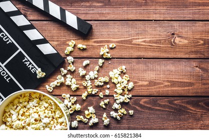Watching Movie With Popcorn On Wooden Background Top View
