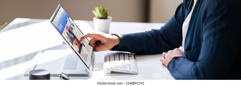 Watching News On Screen. Reading Newspaper Website On Laptop - Powered by Shutterstock