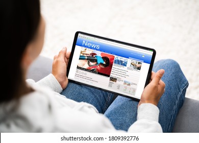 Watching News On Tablet Computer Screen Online At Home - Shutterstock ID 1809392776