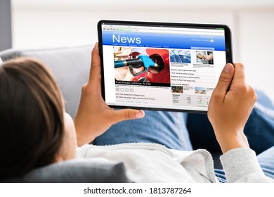 Watching News On Tablet Computer Screen Online At Home - Shutterstock ID 1813787264