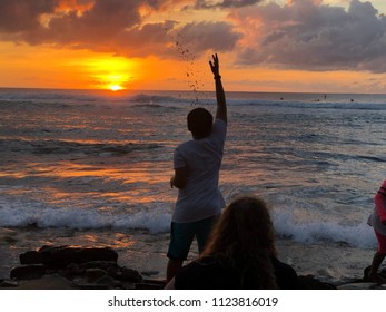 Watching Sunset Kid Throwing Sand