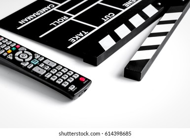 Watching TV With Movie Clapper Board White Background