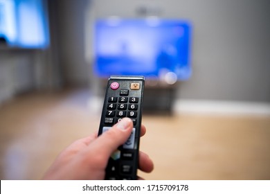 Watching Tv And Using Remote Control