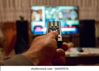 Watching Tv And Using Remote Control