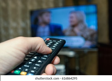 Watching TV And Using Remote Controller