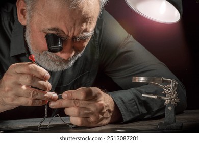 Watchmaker repairing watches looking through magnifying glass monocular. Professional senior watch fixer in repair services workshop - Powered by Shutterstock