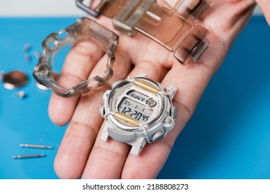 Watchmaker Servicing The Digital Quartz Watch.