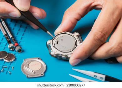 Watchmaker Servicing The Digital Quartz Watch.