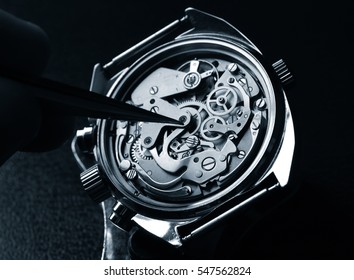 watchmaker working on watch close up detail