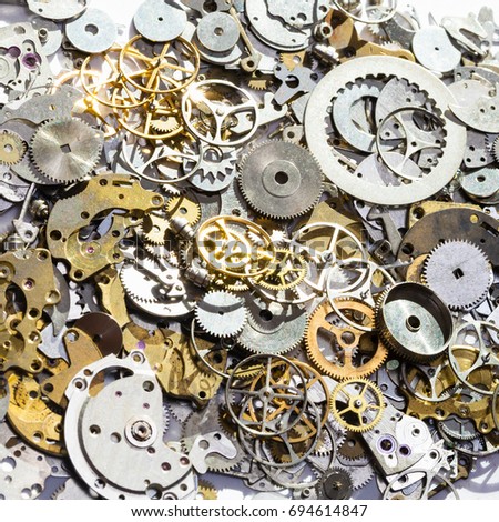 watchmaker workshop - pile of used watch spare parts close up