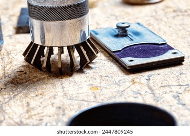 watchmaker's essentials, tarnished with use, await the delicate task of breathing life into timepieces - Powered by Shutterstock