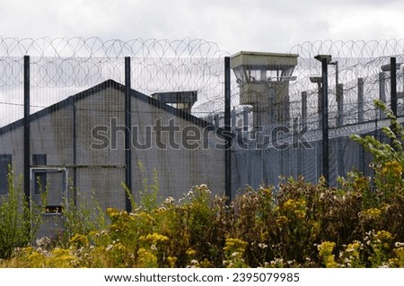 Watchtower, fence and wall outside the former HMP Maze prison, Northern Ireland, famous for it's H-Blocks, 1981 Republican hunger strikes, and a mass escape in 1983.