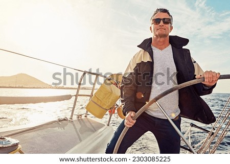 Water adventure, rich man sailing on a yacht and retirement on sea with in blue sky. Travel or freedom, sunshine or relax and mature male on summer vacation or holiday break on cruise boat.