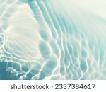 Closeup​ blur​ abstract​ of​ surface​ blue​ water. Abstract​ of​ surface​ blue​ water​ reflected​ with​ sunlight​ for​ background.Top​ view​ of blue​ water.​ Water​ splashed​ abstract​ background.