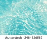 Closeup​ blur​ abstract​ of​ surface​ blue​ water. Abstract​ of​ surface​ blue​ water​ reflected​ with​ sunlight​ for​ background.Top​ view​ of blue​ water.​ Water​ splashed​ abstract​ background.