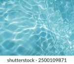 Closeup​ blur​ abstract​ of​ surface​ blue​ water. Abstract​ of​ surface​ blue​ water​ reflected​ with​ sunlight​ for​ background.Top​ view​ of blue​ water.​ Water​ splashed​ abstract​ background.