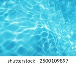 Closeup​ blur​ abstract​ of​ surface​ blue​ water. Abstract​ of​ surface​ blue​ water​ reflected​ with​ sunlight​ for​ background.Top​ view​ of blue​ water.​ Water​ splashed​ abstract​ background.