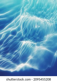 Closeup​ blur​ abstract​ of​ surface​ blue​ water for​ background. Abstract​ of​ surface​ blue​ water​ reflected​ with​ sunlight​ for​ graphic​ design.Top​ view​ of blue​ water​ for​ background.