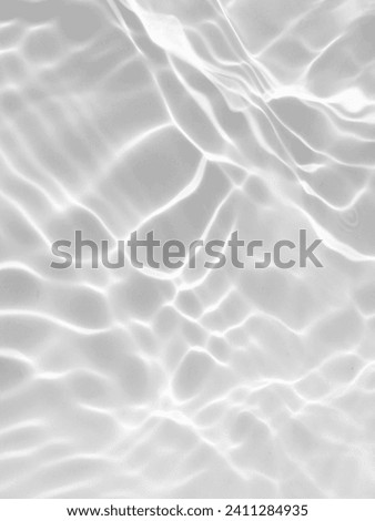 Closeup​ blur​ abstract​ of​ surface​ blue​ water. Abstract​ of​ surface​ blue​ water​ reflected​ with​ sunlight​ for​ background.Top​ view​ of blue​ water.​ Water​ splashed​ abstract​ background.