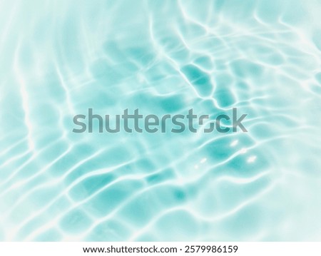 Closeup​ blur​ abstract​ of​ surface​ blue​ water. Abstract​ of​ surface​ blue​ water​ reflected​ with​ sunlight​ for​ background.Top​ view​ of blue​ water.​ Water​ splashed​ abstract​ background.