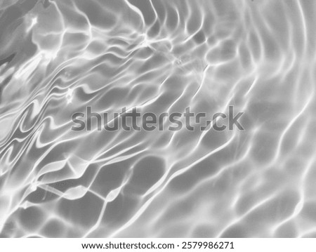 Closeup​ blur​ abstract​ of​ surface​ blue​ water. Abstract​ of​ surface​ blue​ water​ reflected​ with​ sunlight​ for​ background.Top​ view​ of blue​ water.​ Water​ splashed​ abstract​ background.