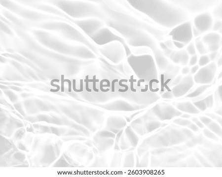 Closeup​ blur​ abstract​ of​ surface​ blue​ water. Abstract​ of​ surface​ blue​ water​ reflected​ with​ sunlight​ for​ background.Top​ view​ of blue​ water.​ Water​ splashed​ abstract​ background.