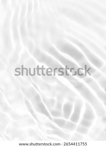 Closeup​ blur​ abstract​ of​ surface​ blue​ water. Abstract​ of​ surface​ blue​ water​ reflected​ with​ sunlight​ for​ background.Top​ view​ of blue​ water.​ Water​ splashed​ abstract​ background.