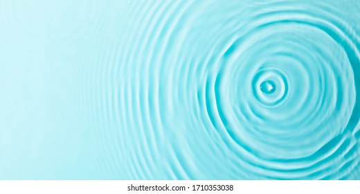 Water background. Blue water texture, surface of blue swimming pool. Spa concept background. Flat lay, top view, copy space, banner