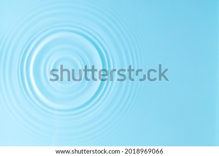 Water background. Blue water texture, surface of blue swimming pool. Spa concept background. Flat lay, top view, copy space