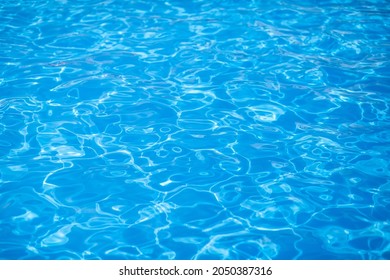 Water Background, Ripple And Flow With Waves. Summer Blue Swiming Pool Pattern. Sea, Ocean Surface. Overhead Top View With Place For Text.