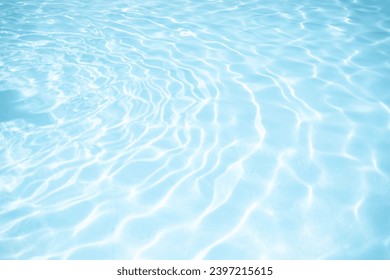 Water background, ripple and flow with waves. Summer blue swimming pool pattern. Ripple Water in swimming pool with sun reflection - Powered by Shutterstock
