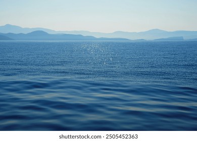 Water background texture. Sea surface in sunset light. Breezy wavy seawater. Sea water texture. Teal blue ocean view. Fresh water of lake. Relaxing natural photo wallpaper. calm sea surface - Powered by Shutterstock