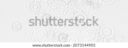 Water background. White transparent water texture, blue mint water surface with rings and ripple. Spa concept background. Flat lay, top view, copy space, copy-space, place for text.