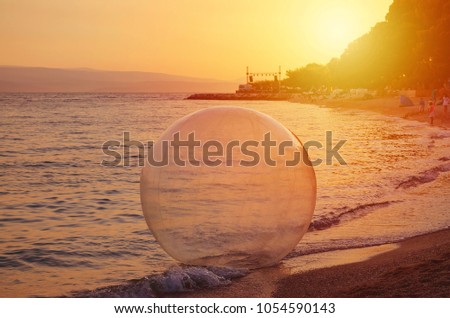 water ball on the sunset beach at summer
