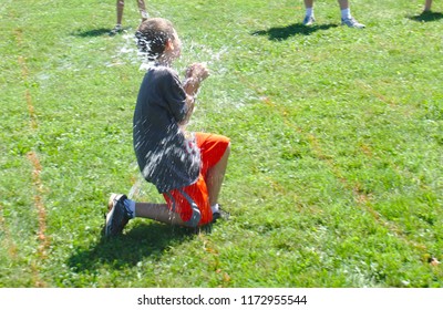 Water Balloon Bursts As A Boy Tries To Catch It