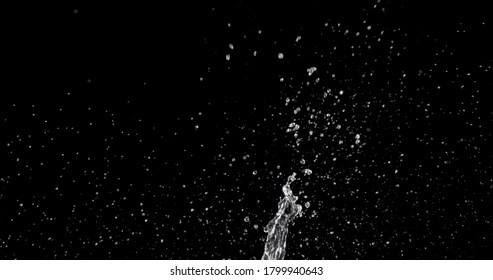 water being thrown against a black background. - Powered by Shutterstock