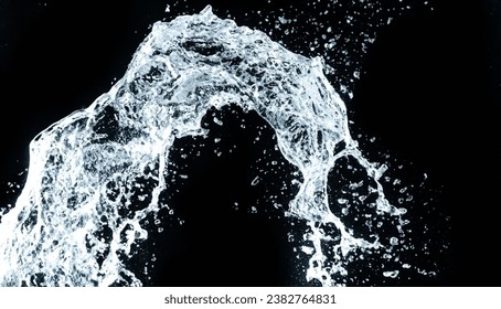water being thrown against a black background